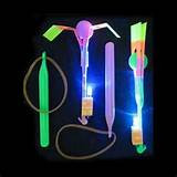 LIGHT UP SLING SHOT SPINNING UMBRELLA SHOOTERS (Sold by the piece or dozen)