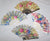 RAINBOW GLITTER FLOWER 9 INCH HAND FAN ( sold by the piece or  dozen )